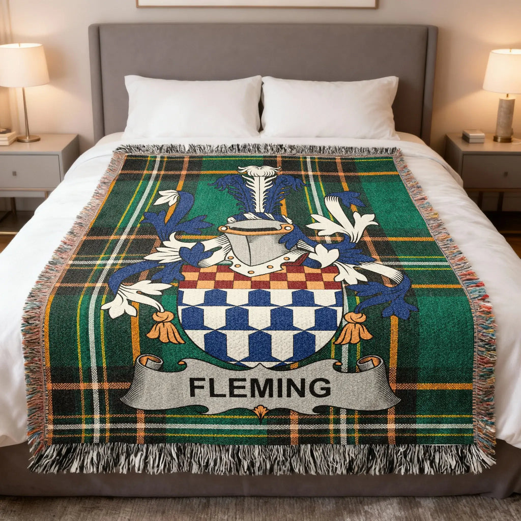 Fleming family crest on a plaid woven blanket with fringe.