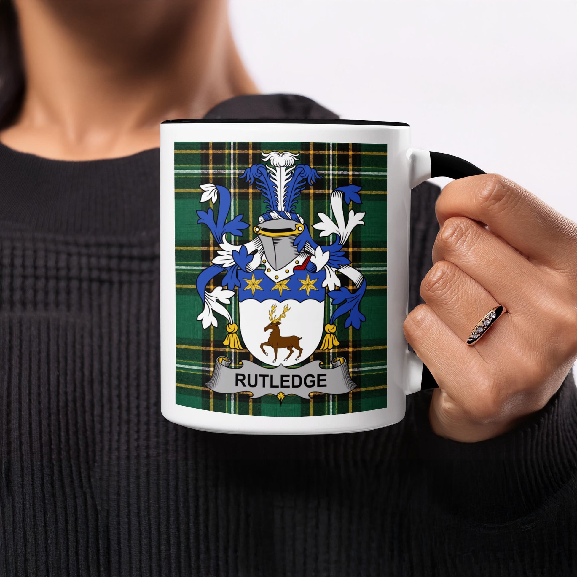 Rutledge coat of arms on a white mug with black handle.