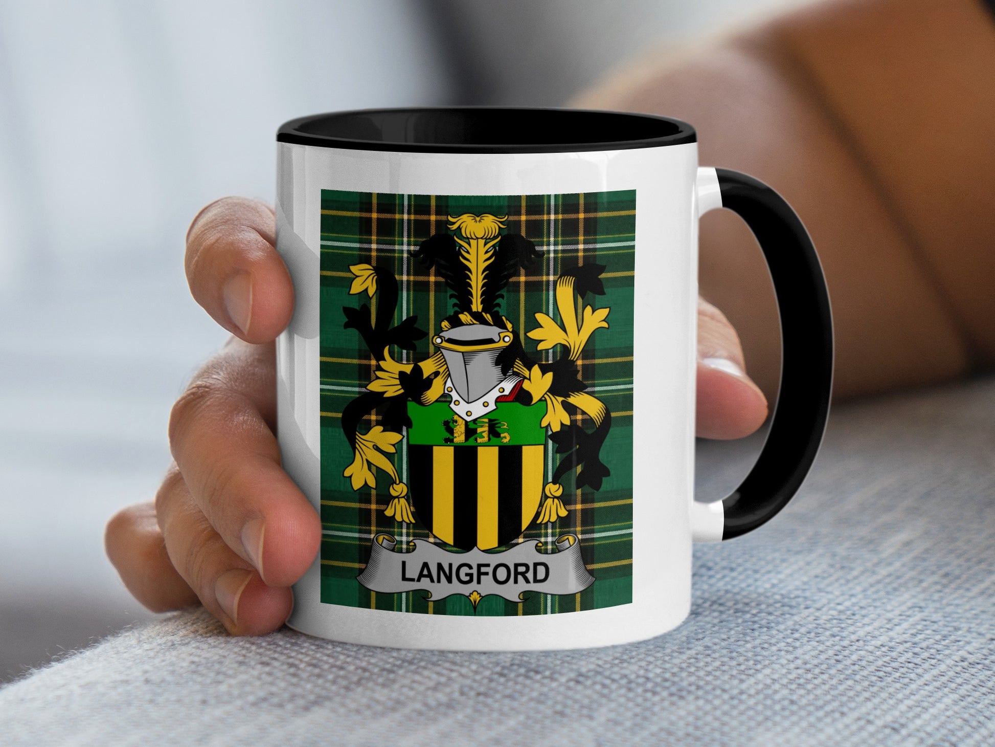 White mug with black rim featuring Langford family crest on green plaid background.