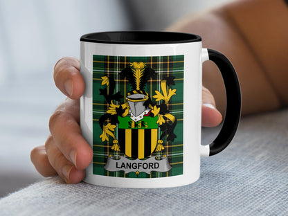 White mug with black rim featuring Langford family crest on green plaid background.