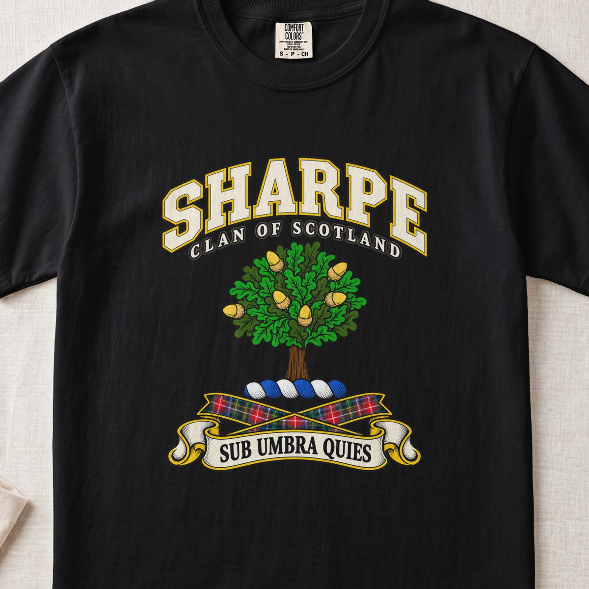 Sharpe Scottish clan T-shirt in Black, front view with a green tree with golden acorns and motto design.