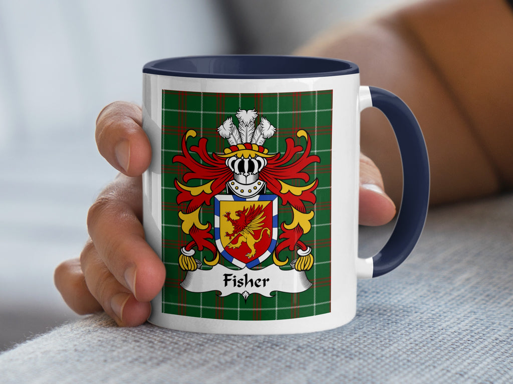 Mug with Fisher family crest on green tartan, held by a hand.
