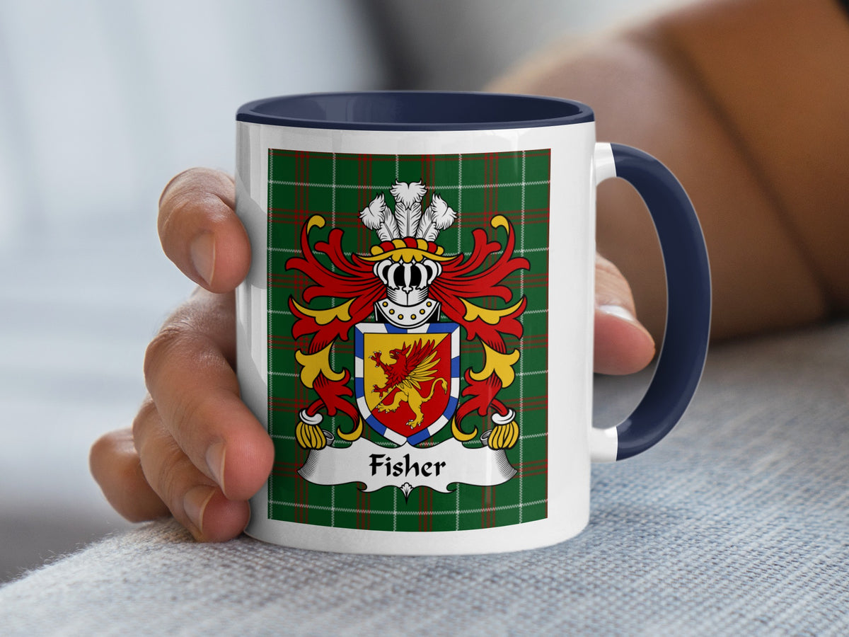 Mug with Fisher family crest on green tartan, held by a hand.