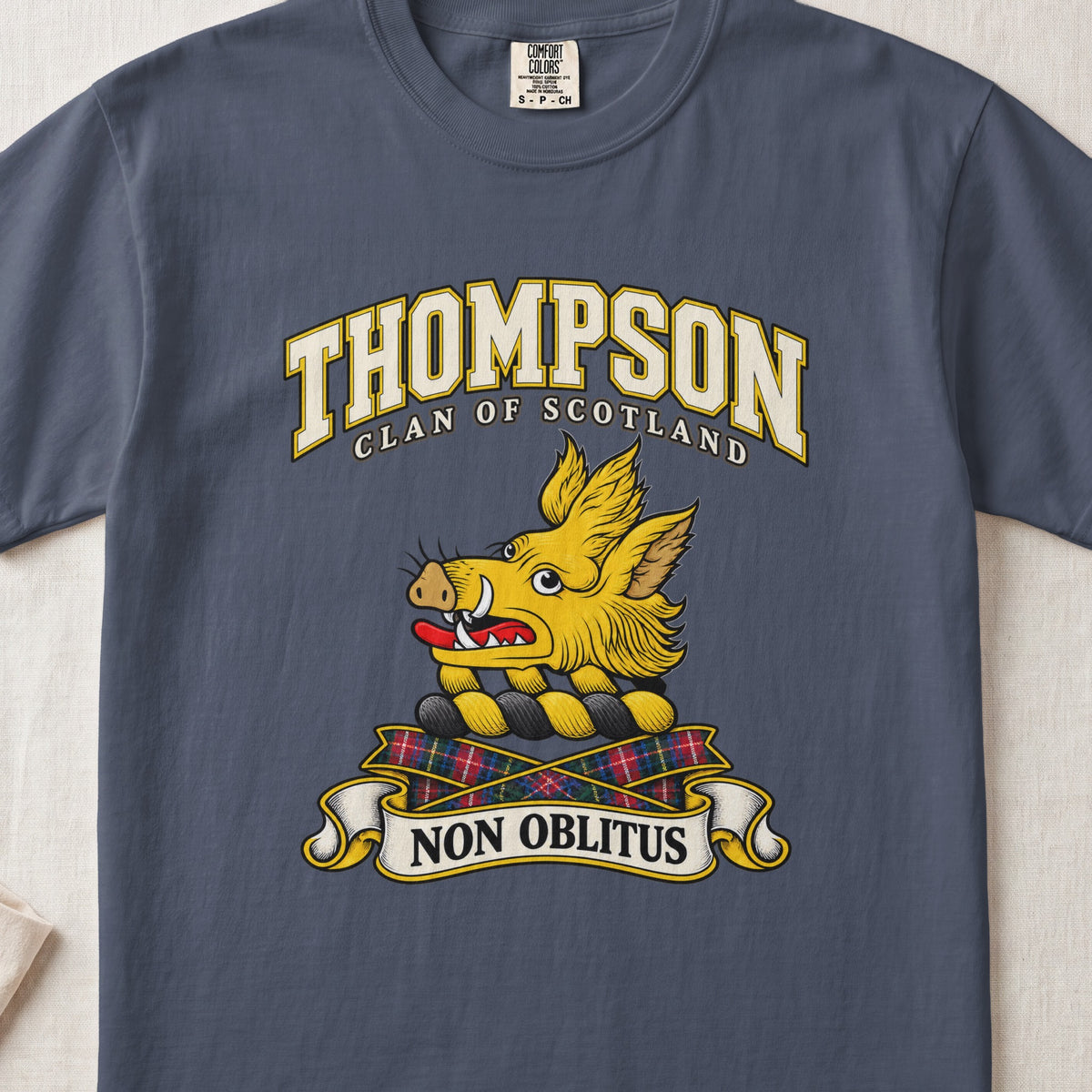 Thompson Scottish clan T-shirt in Midnight, front view with a golden boar head and motto banner.