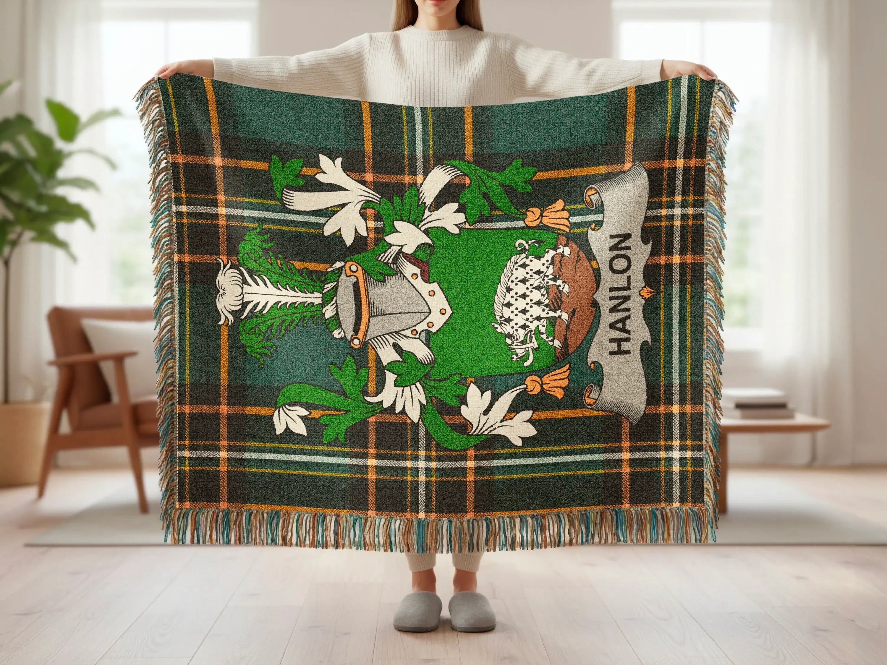 Green tartan blanket with Clan Hanlon crest and tassels.