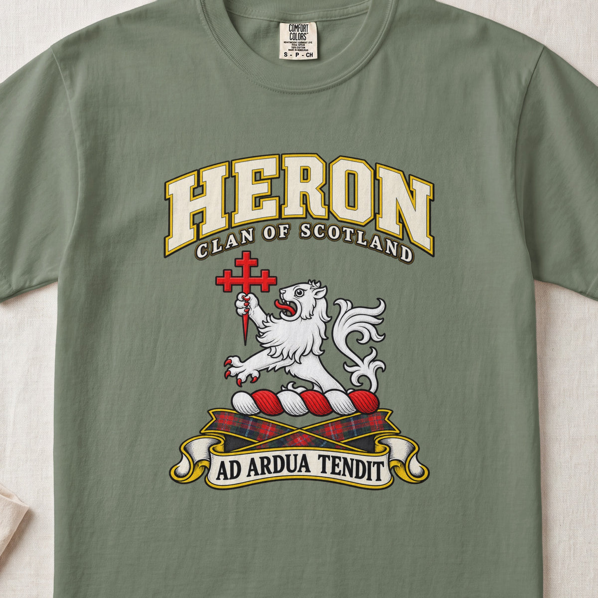 Heron Scottish clan T-shirt in Moss, front view with a white lion holding a red cross and motto banner.