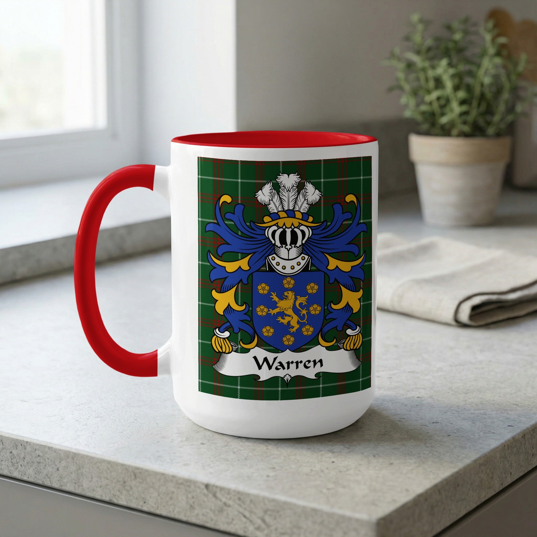 White mug with red handle featuring the Warren family crest on a tartan background.