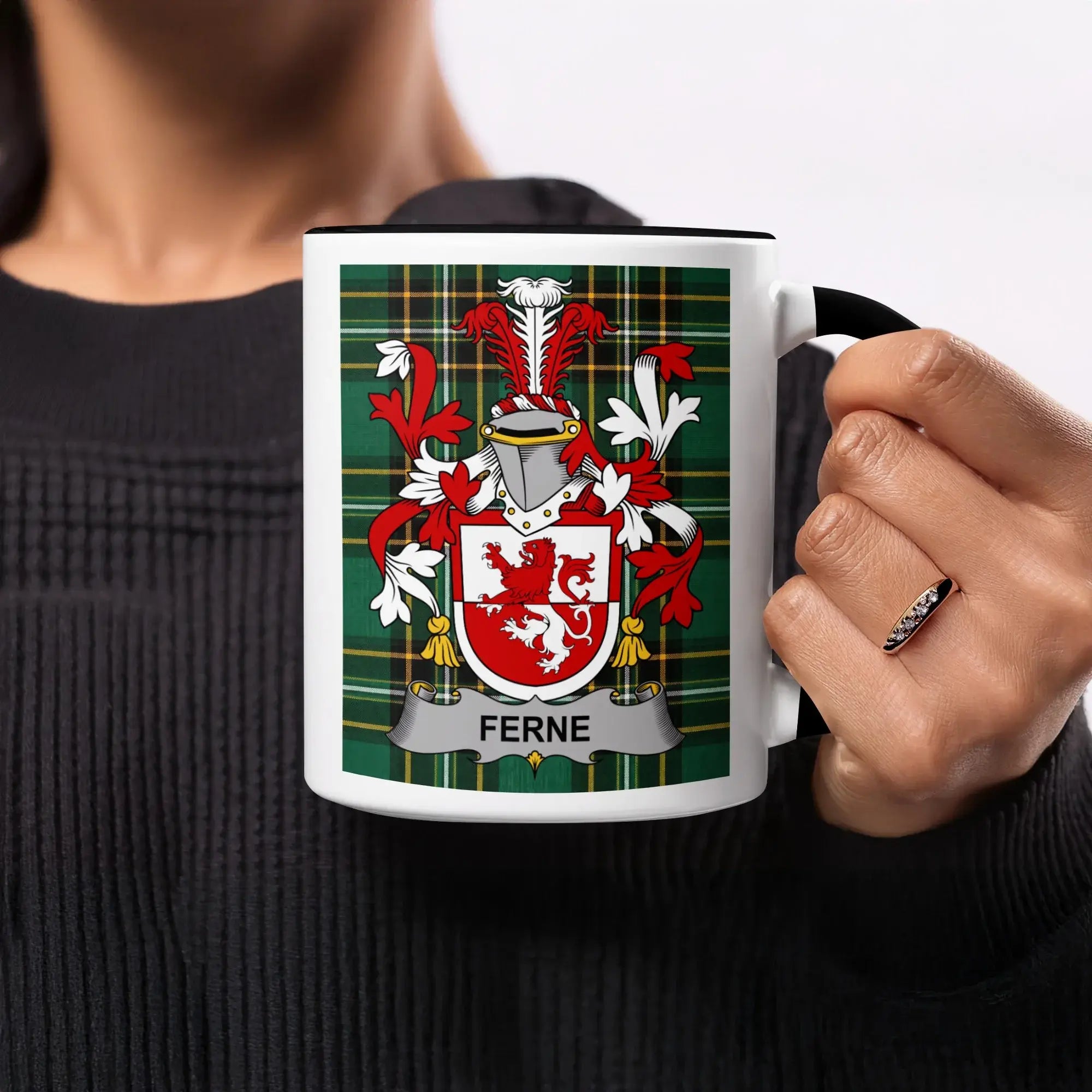 Mug with Ferne family crest on green plaid background.