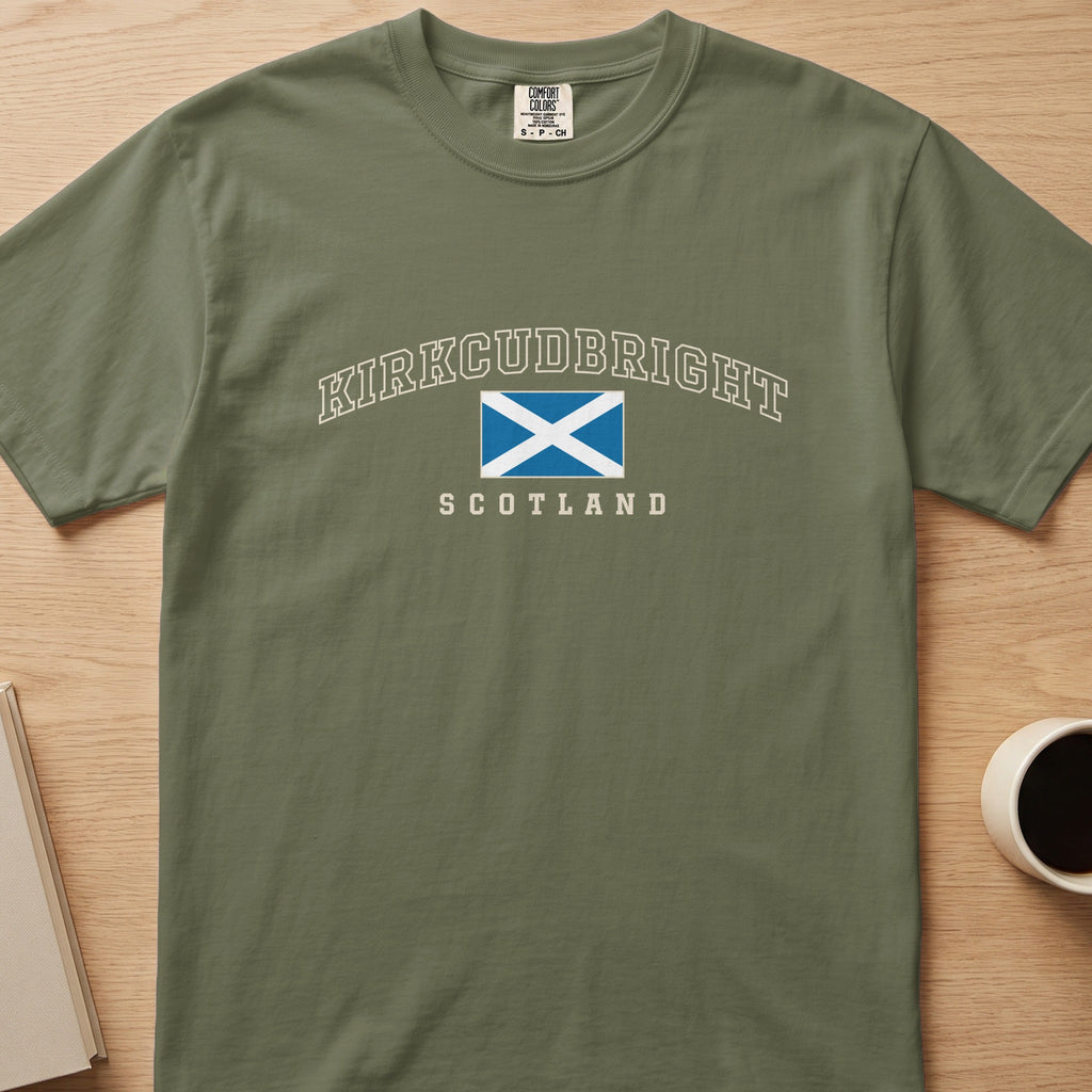Hemp green Kirkcudbright Scotland Comfort Colors T-shirt laid flat with the cream collegiate design