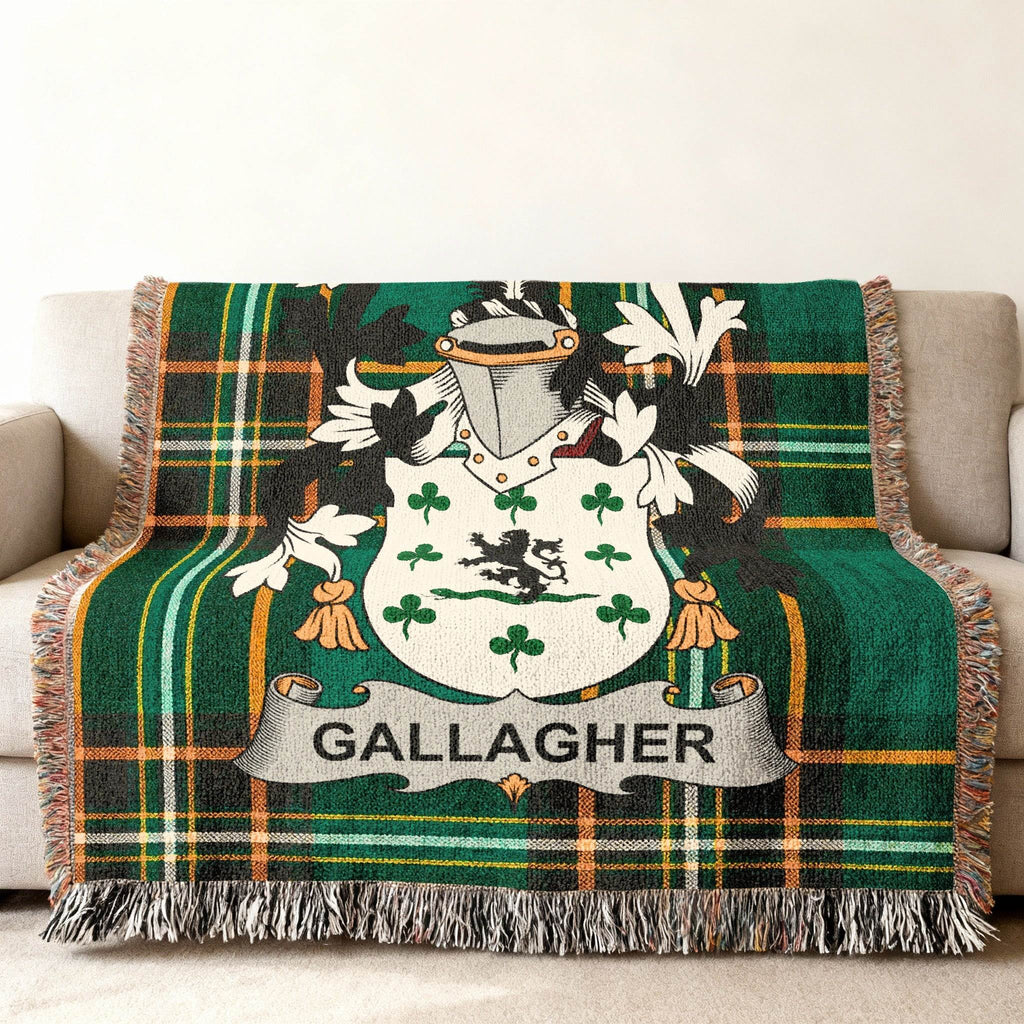 Gallagher family crest on a green tartan plaid throw blanket.