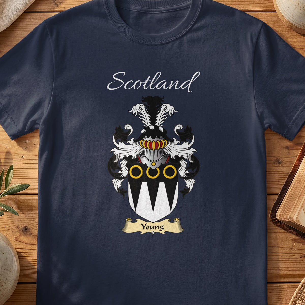 Navy Youngs heritage T-shirt laid flat with “Scotland” and the colourful family shield design.