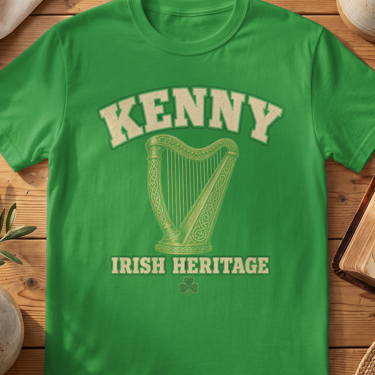 Kenny Irish harp T-shirt in Irish Green, with cream surname lettering, a gold-toned harp, green shamrock and “Irish Heritage” text.