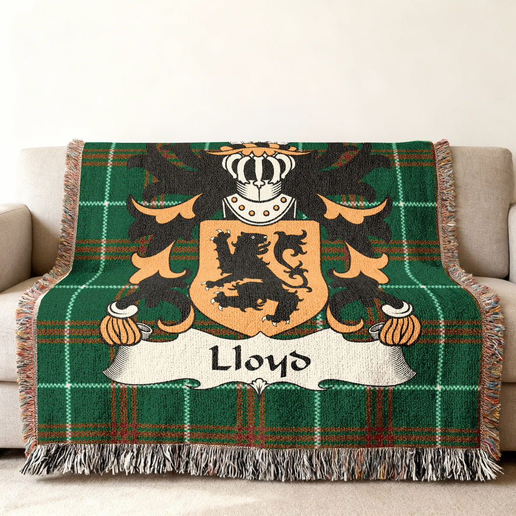 Green plaid throw blanket with the Lloyd family crest.