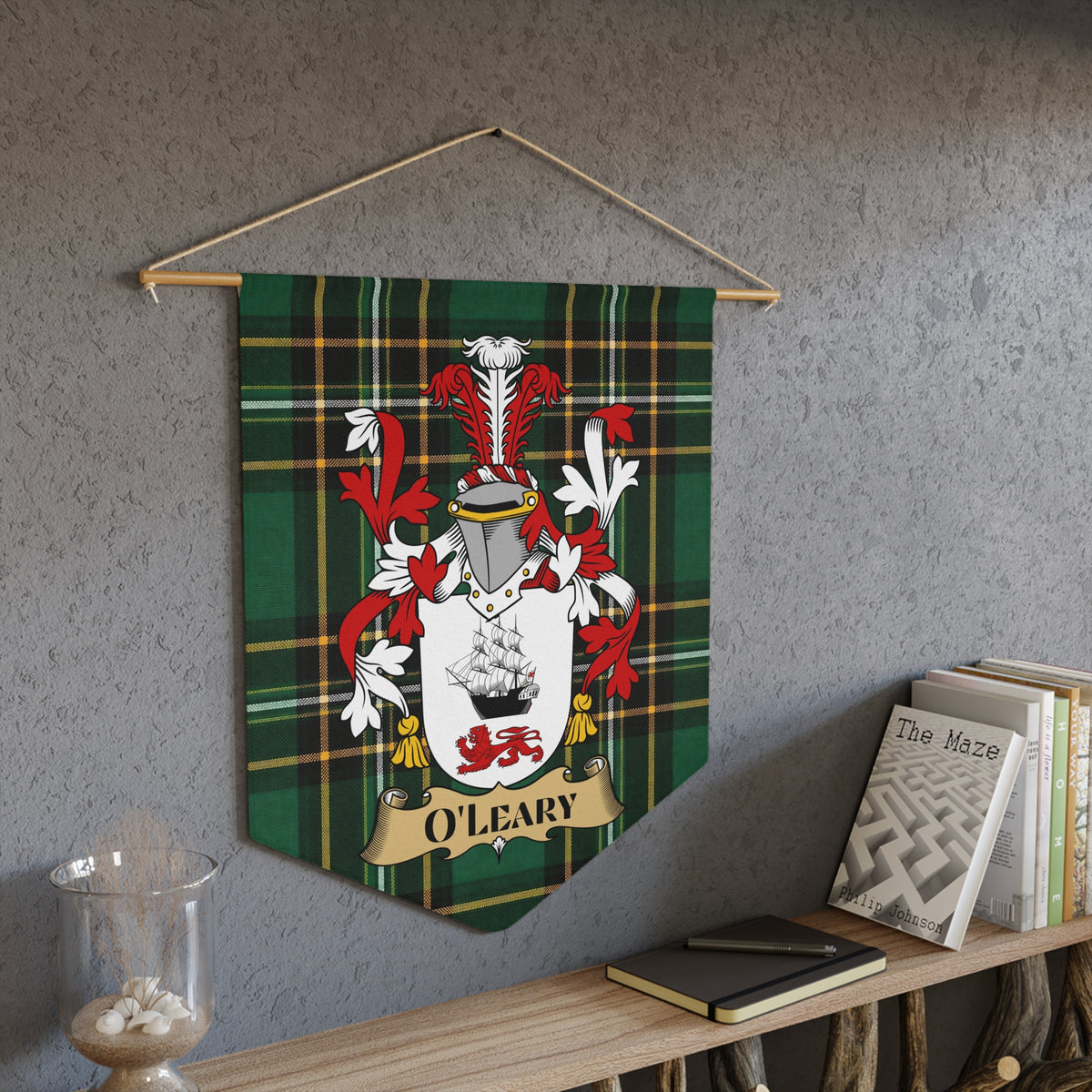 O'Leary coat of arms on green tartan pennant hanging on a wall.
