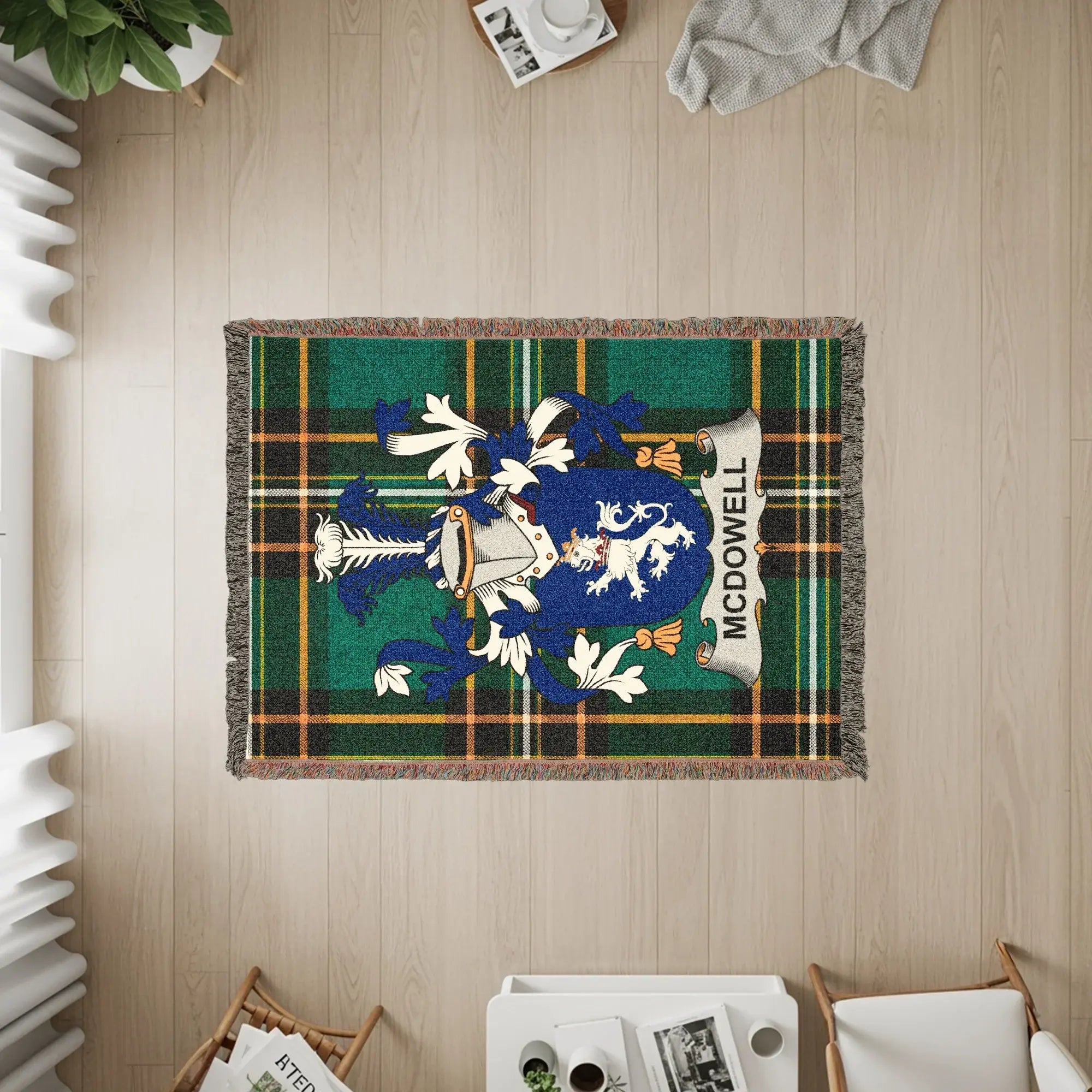 McDowell family crest on a green and blue plaid woven throw blanket.
