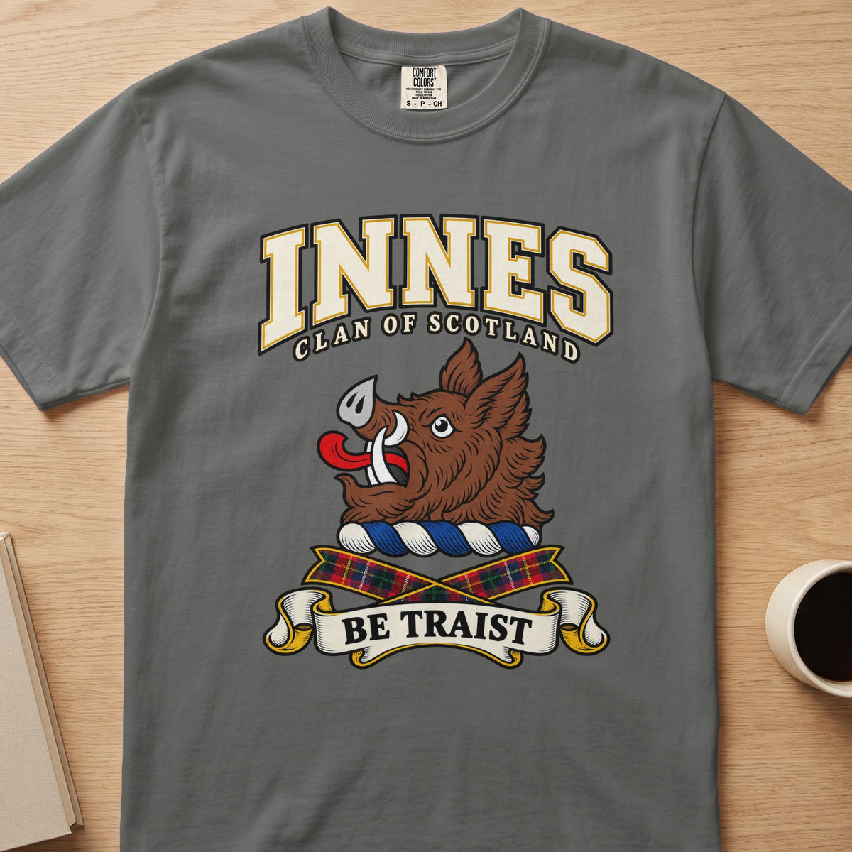Innes clan crest with brown boar head on a gray Comfort Colors T-shirt, front view
