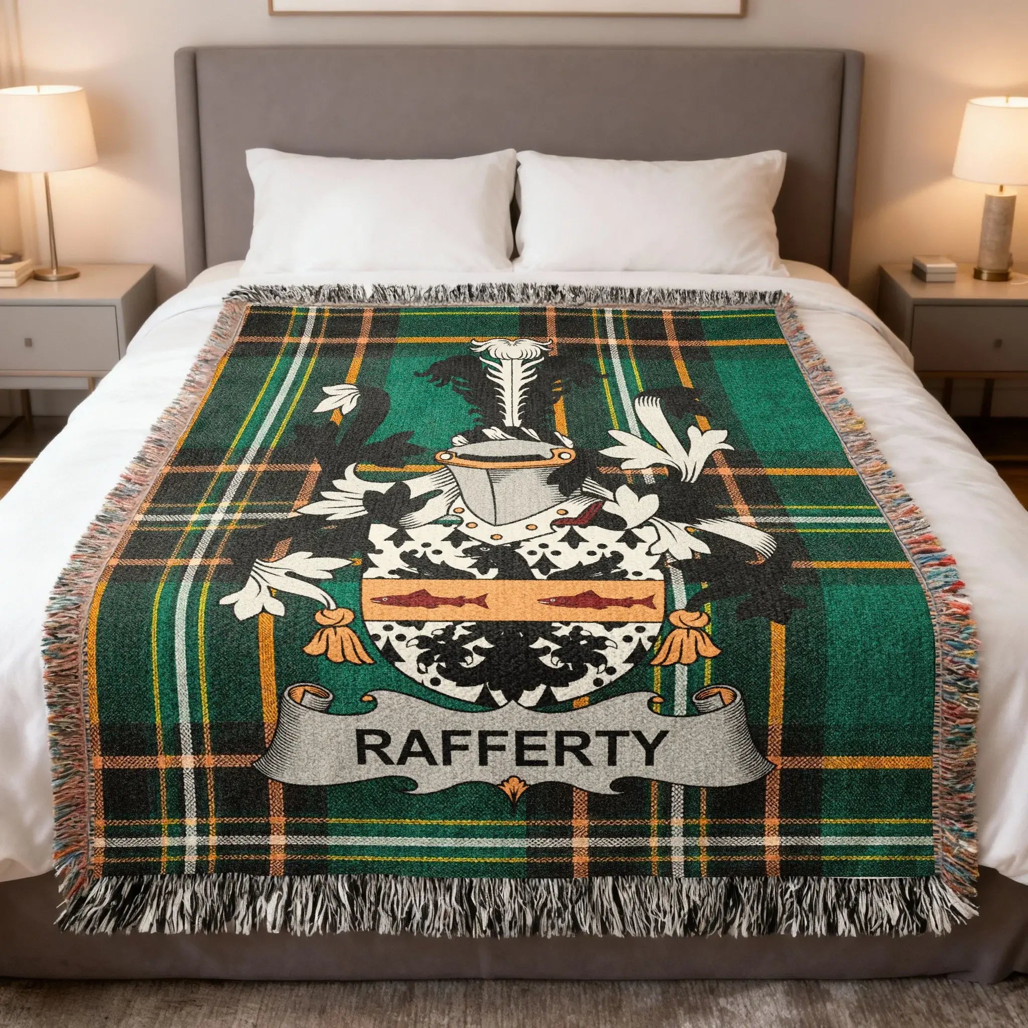 Tartan blanket with Rafferty coat of arms displayed on a bed.