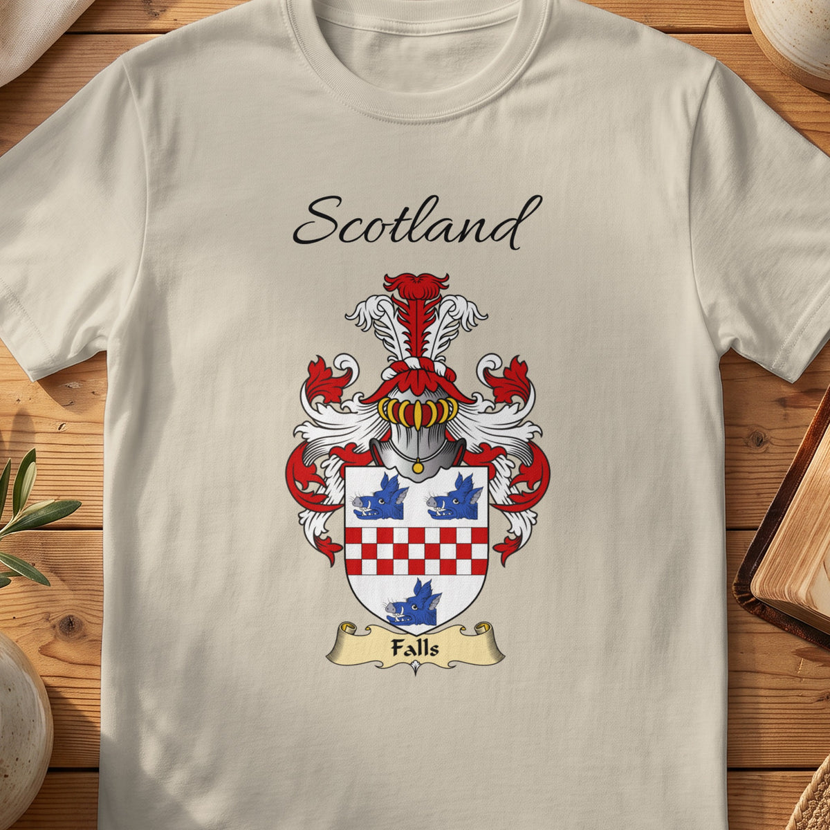 Sand Falls Scottish family shield T-shirt featuring blue motifs above and below a red checked band