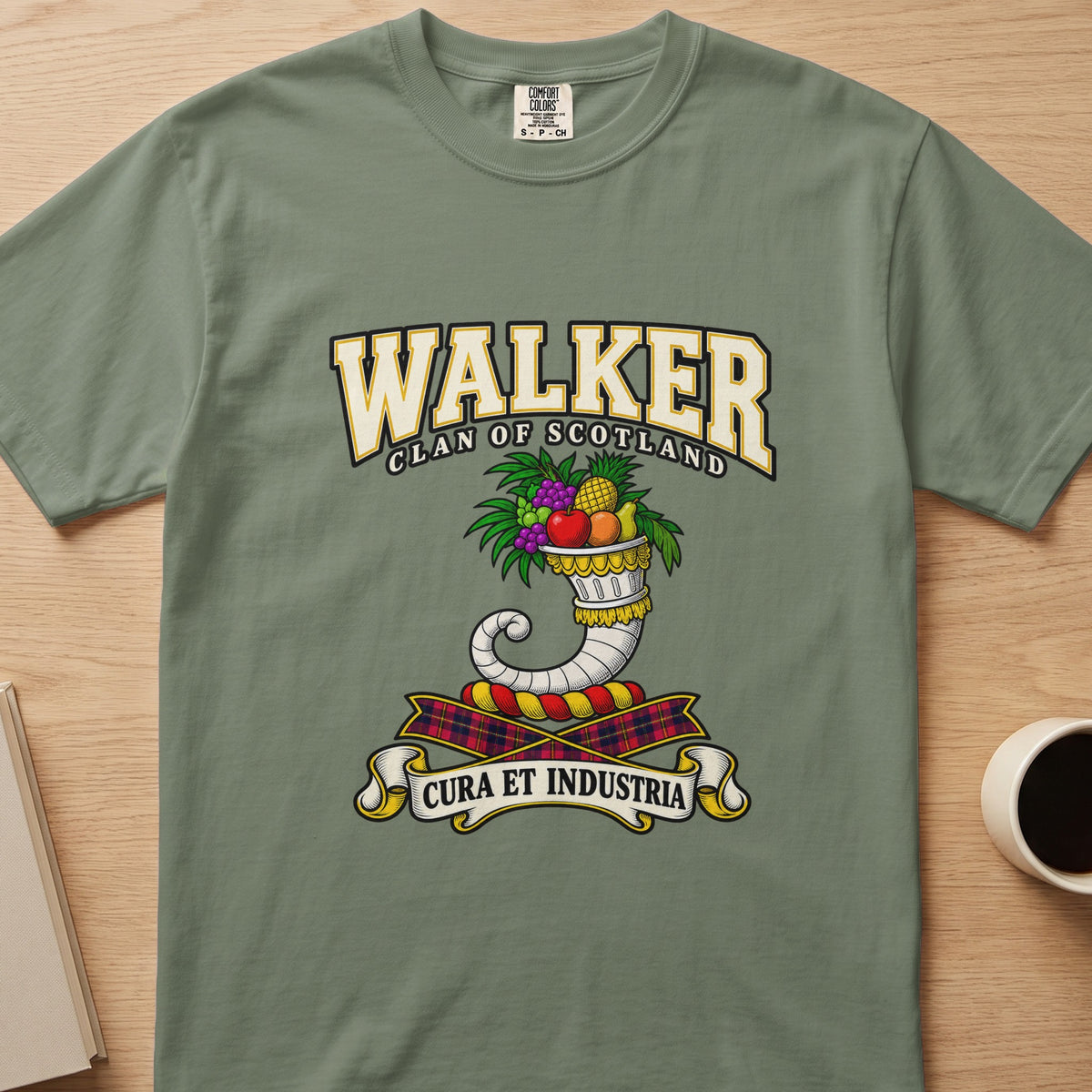 Walker clan T-shirt in sage green, front view with curved horn filled with colorful flowers
