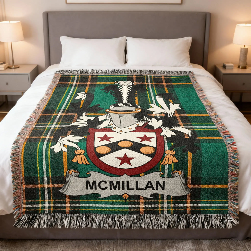 McMillan family crest on a green tartan plaid blanket with fringe.