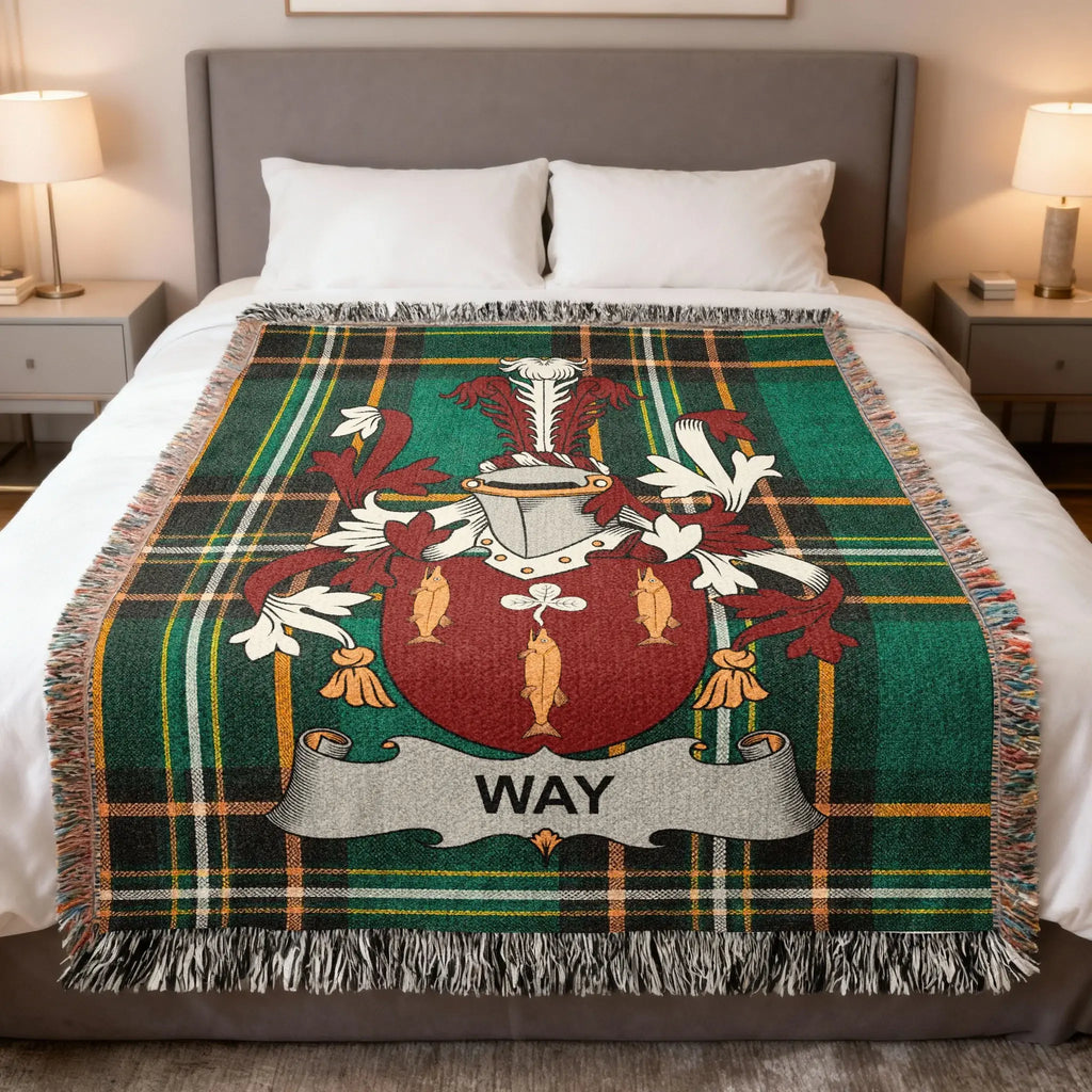 Tartan blanket with Way family crest in red, green, and gold.