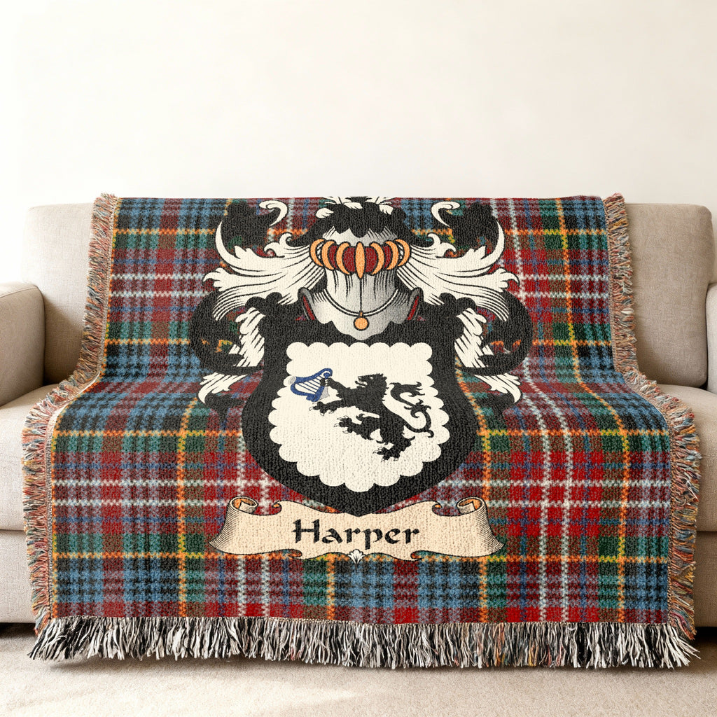 Harper family crest emblem on a Caledonia tartan woven blanket