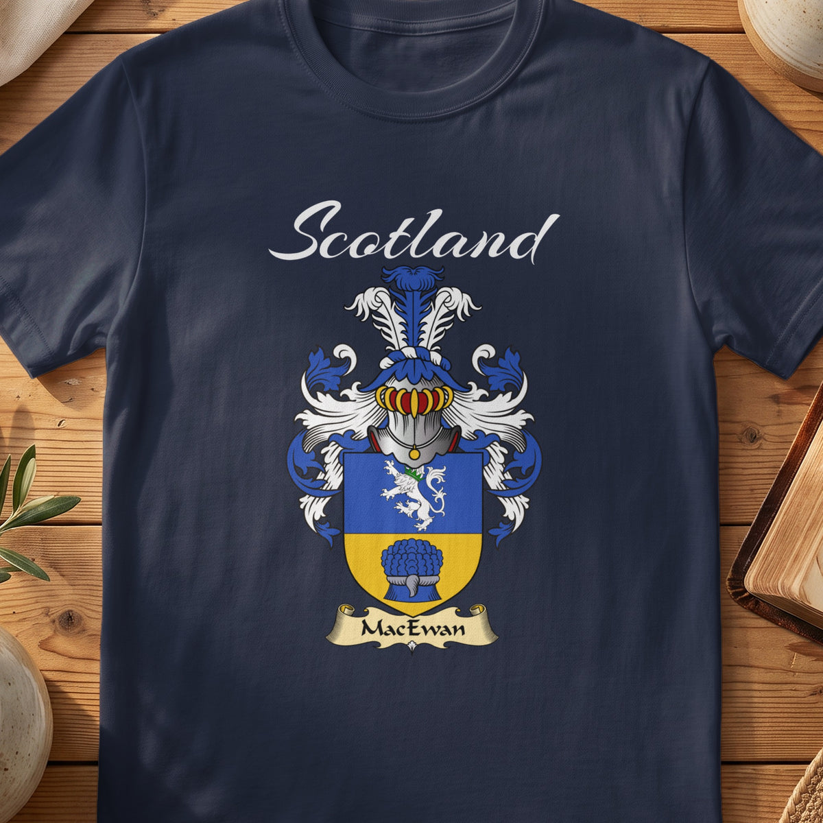 Navy MacEwan family shield T-shirt featuring a blue-and-gold shield with a white lion