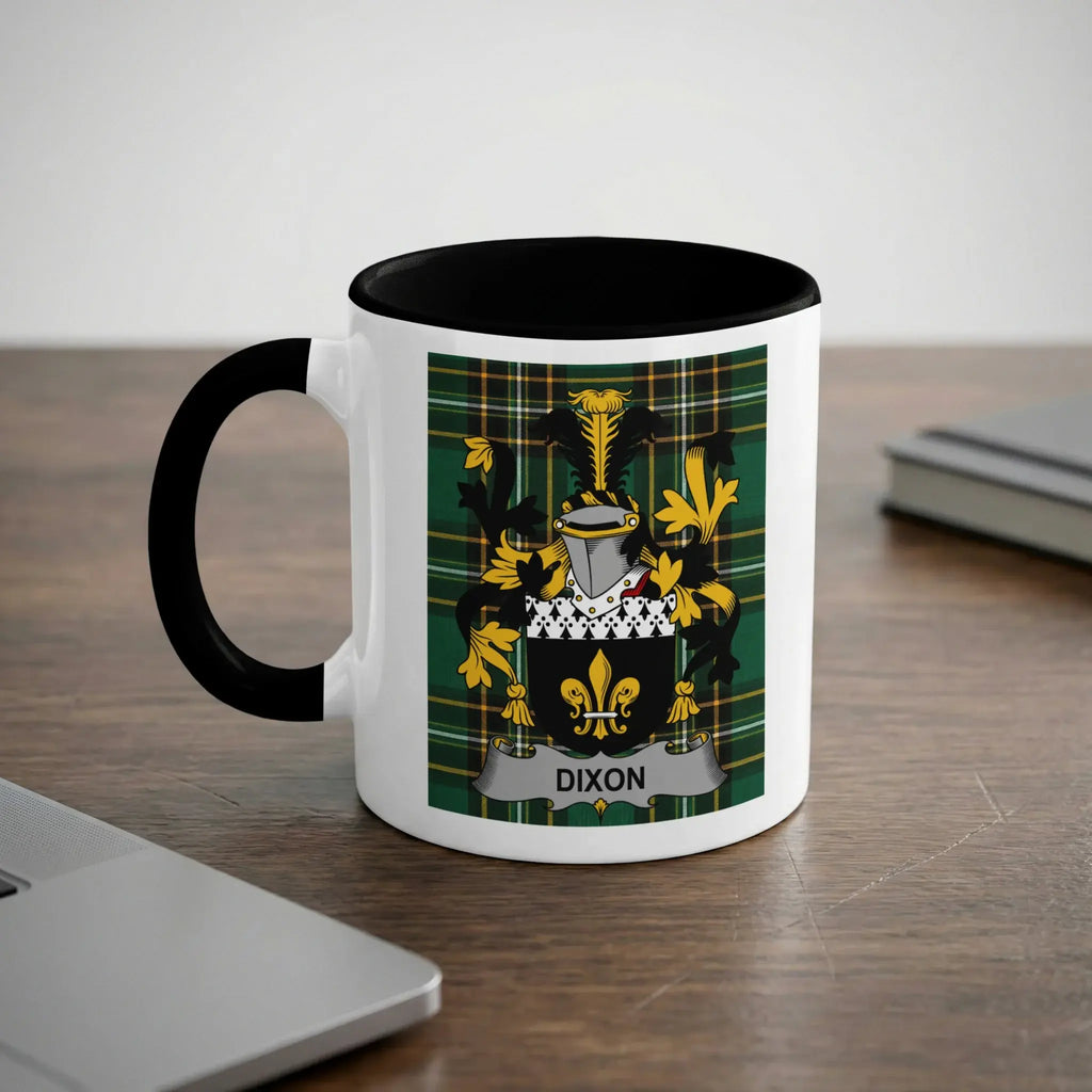 White mug with black handle featuring the Dixon family crest on a tartan background.