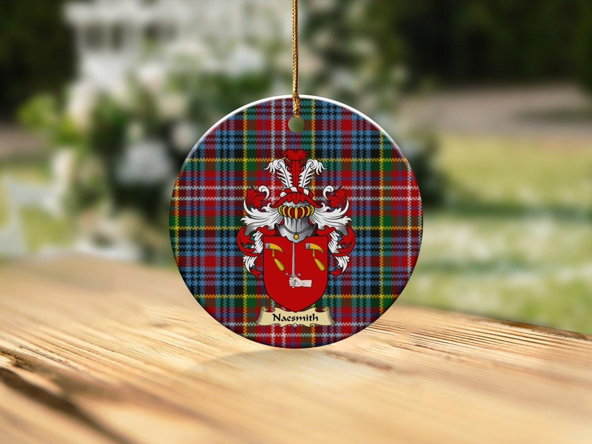 Round Naesmith Scottish clan ornament with family crest on a Caledonia tartan background