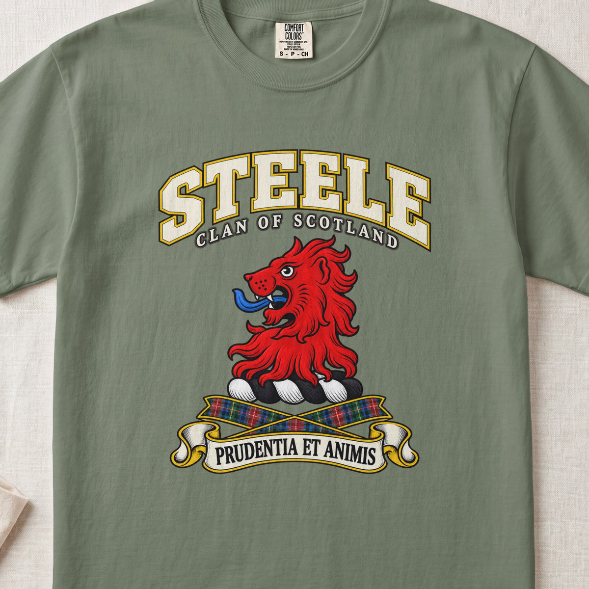 Steele Scottish clan T-shirt in Moss, front view with a red lion head and motto design.