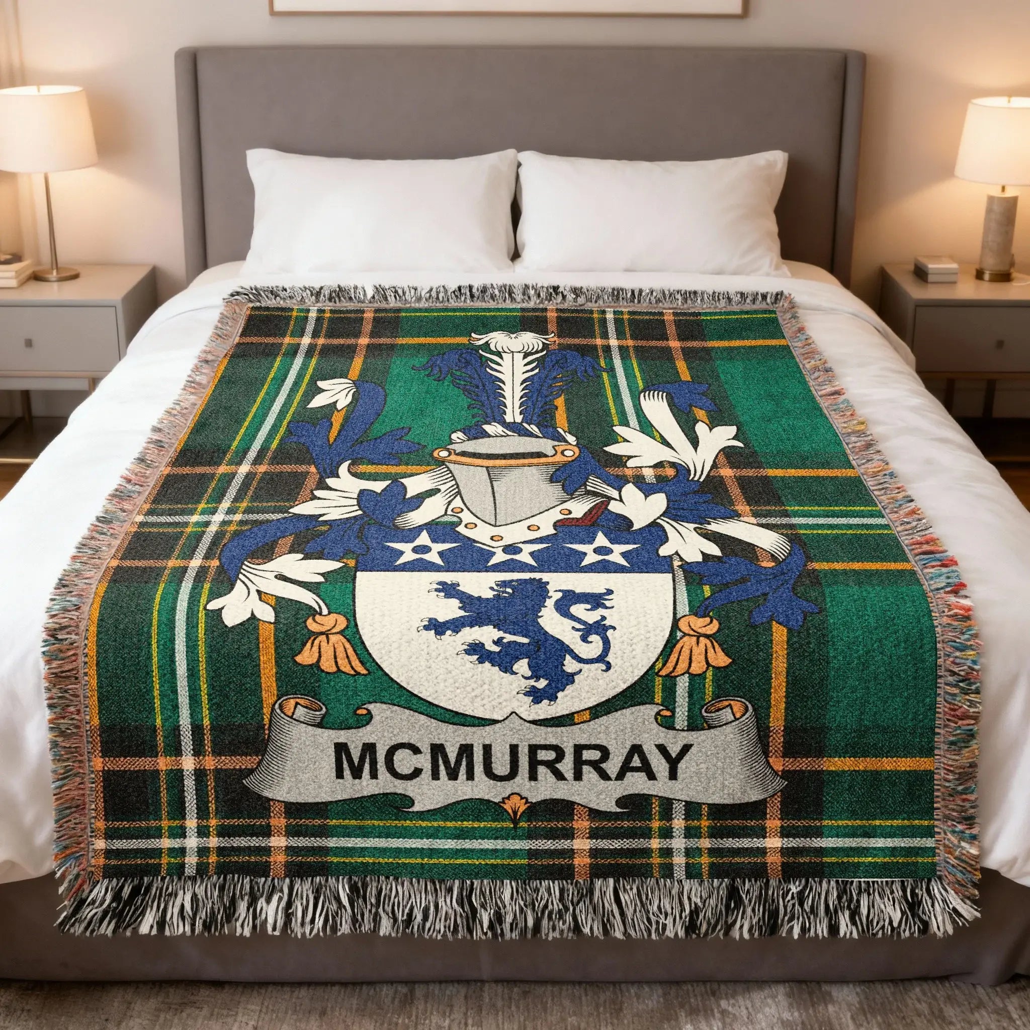 McMurray tartan blanket with coat of arms, draped on a bed.