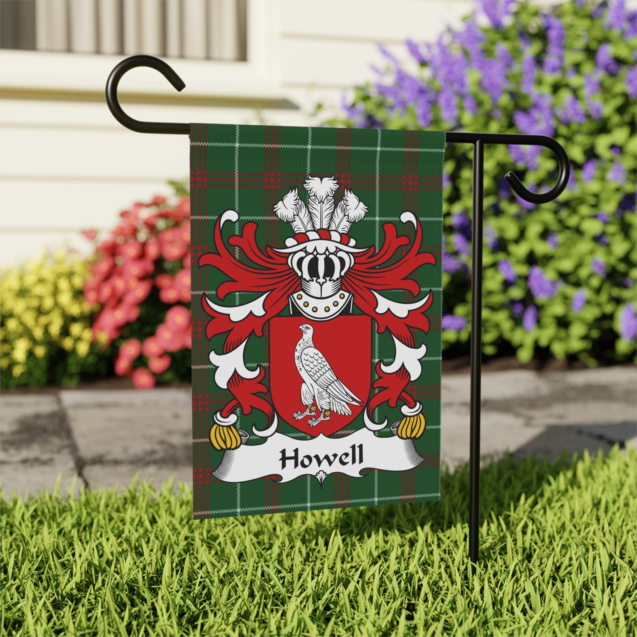 Howell family crest on a tartan plaid garden flag.