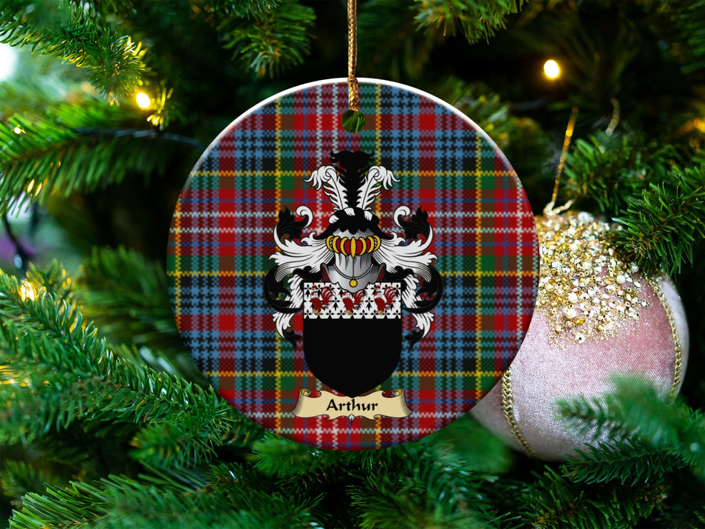 Arthur Scottish clan ceramic ornament with family crest on a Caledonia tartan background, hanging on a Christmas tree