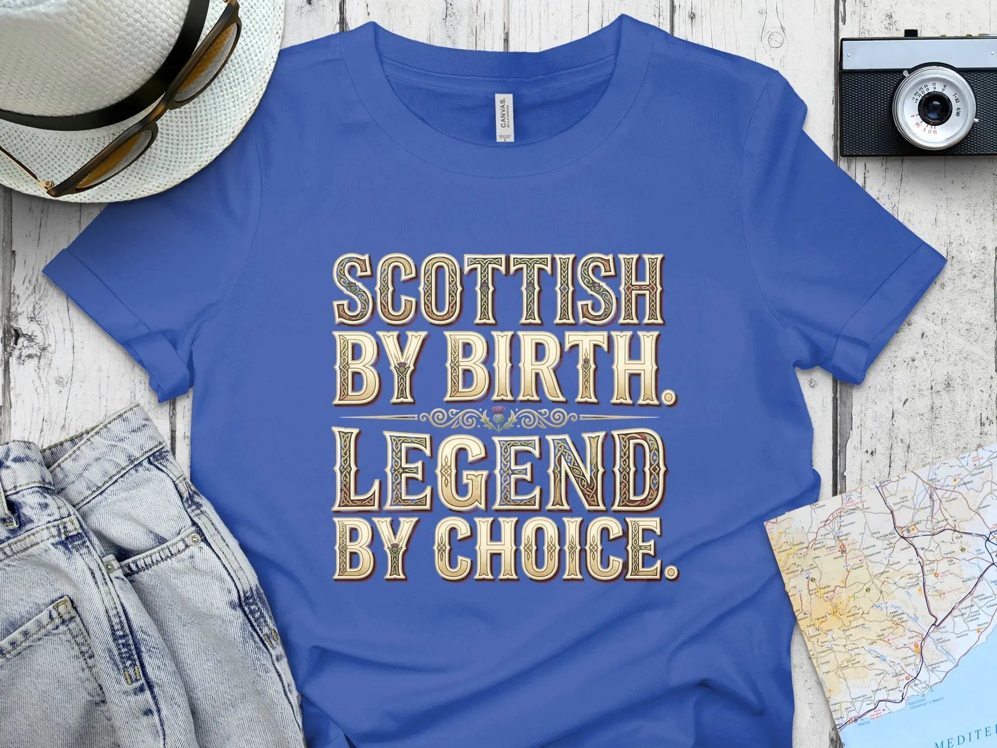 Blue t-shirt with "Scottish by Birth. Legend by Choice." text.