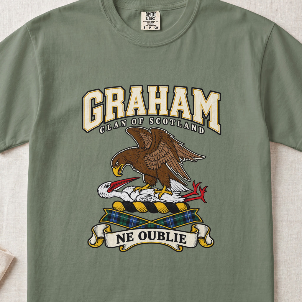Graham graphic T-shirt in Moss green, front flat lay showing varsity lettering and brown eagle-like bird over a white long-necked bird with red beak and legs.