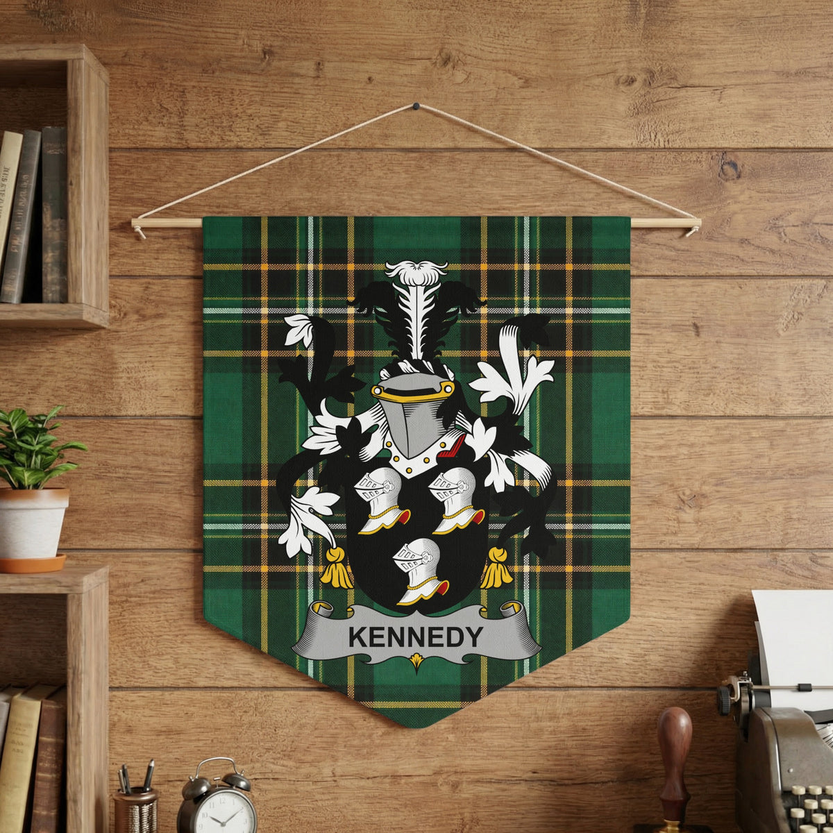 Kennedy family crest on green tartan banner hanging against wood paneling.