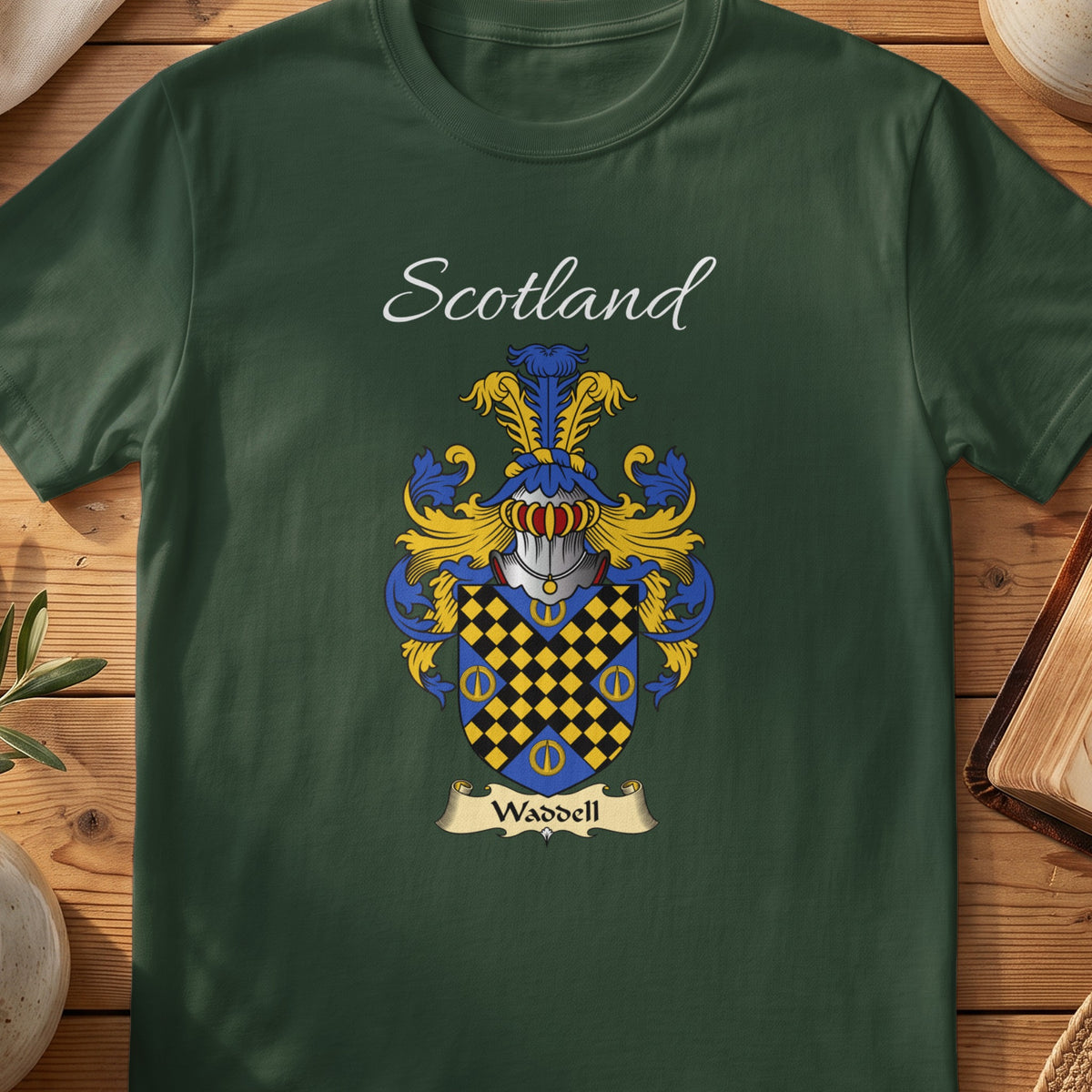 Forest Green Waddell Scottish T-shirt laid flat with coat of arms artwork and “Scotland” text.