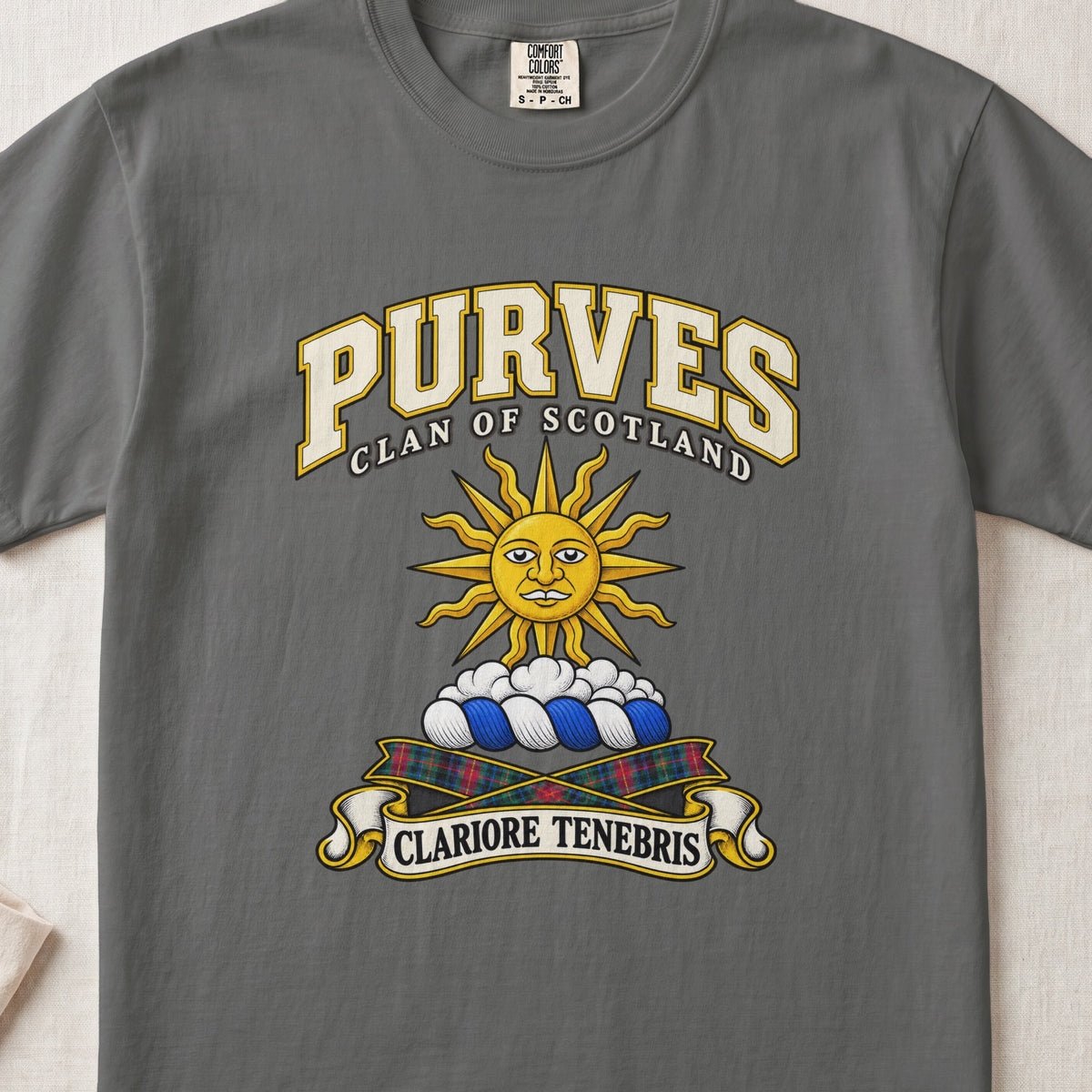 Purves Scottish clan T-shirt in Pepper, front view with a golden sun above clouds and motto design.
