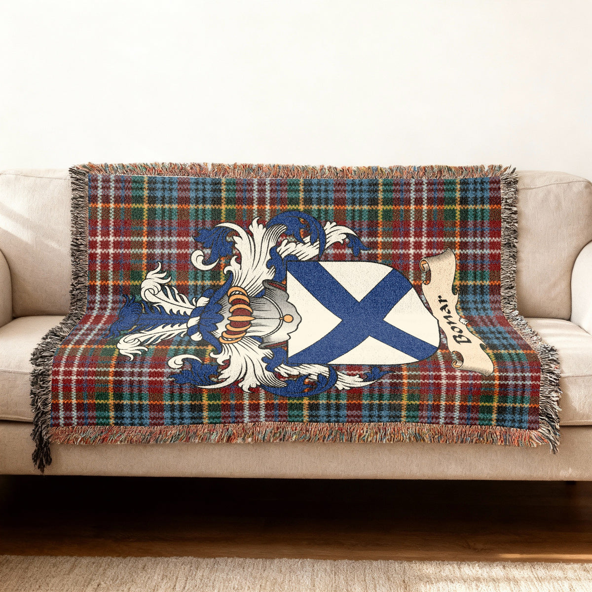 Bonar Scottish woven blanket with family shield and Caledonia tartan background
