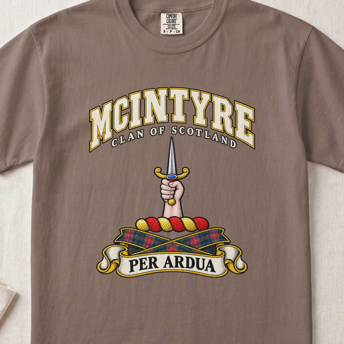 McIntyre Scottish clan T-shirt in Espresso, front view with a hand holding an upright dagger and motto banner.