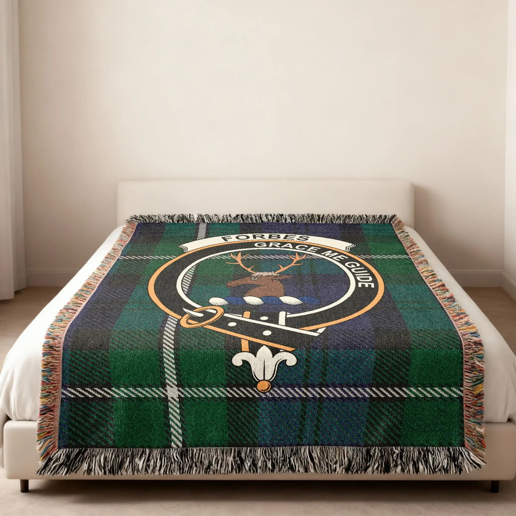 Forbes clan traditional Scottish tartan woven blanket — stag crest at centre, fringe edge visible