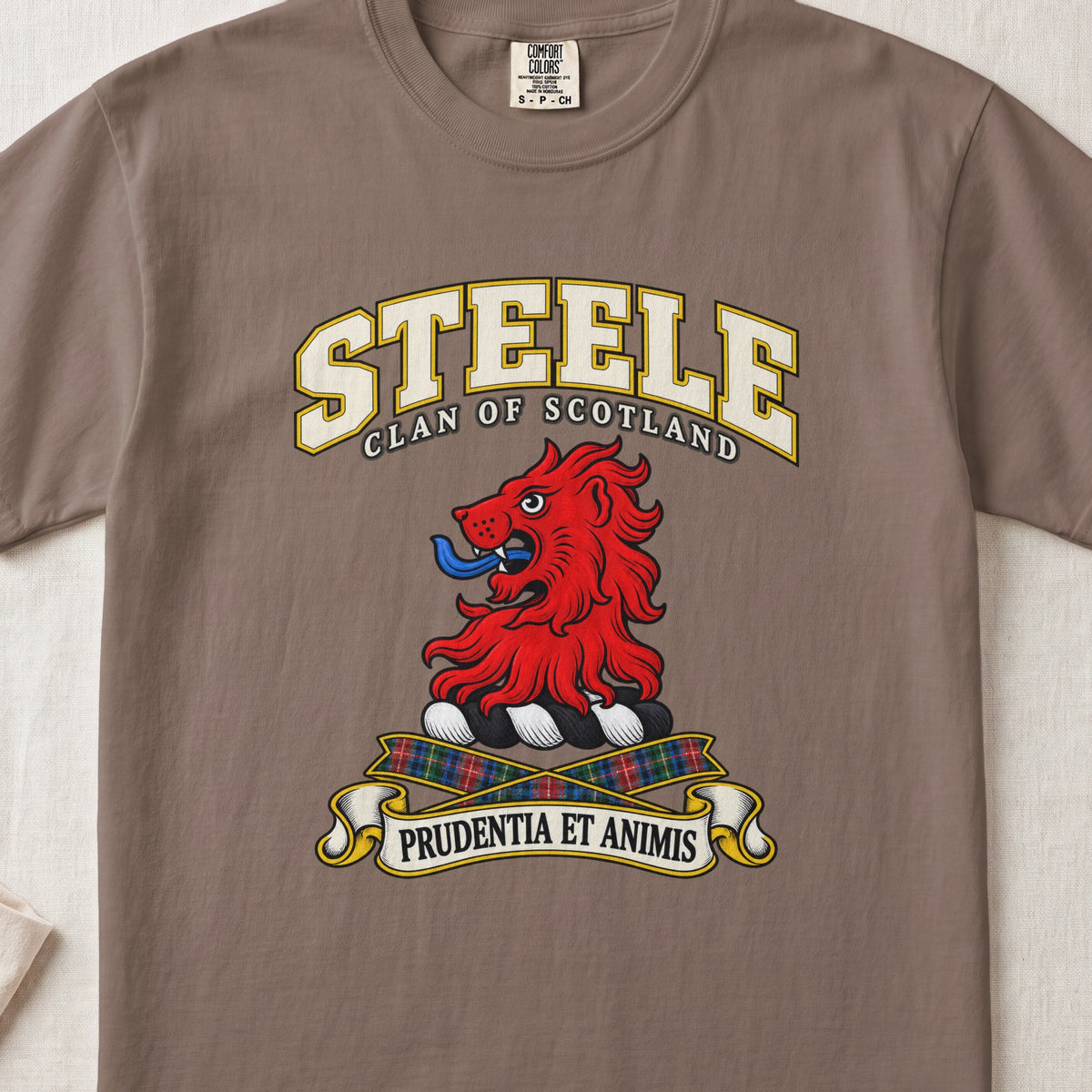 Steele Scottish clan T-shirt in Espresso, front view with a red lion head and motto design.