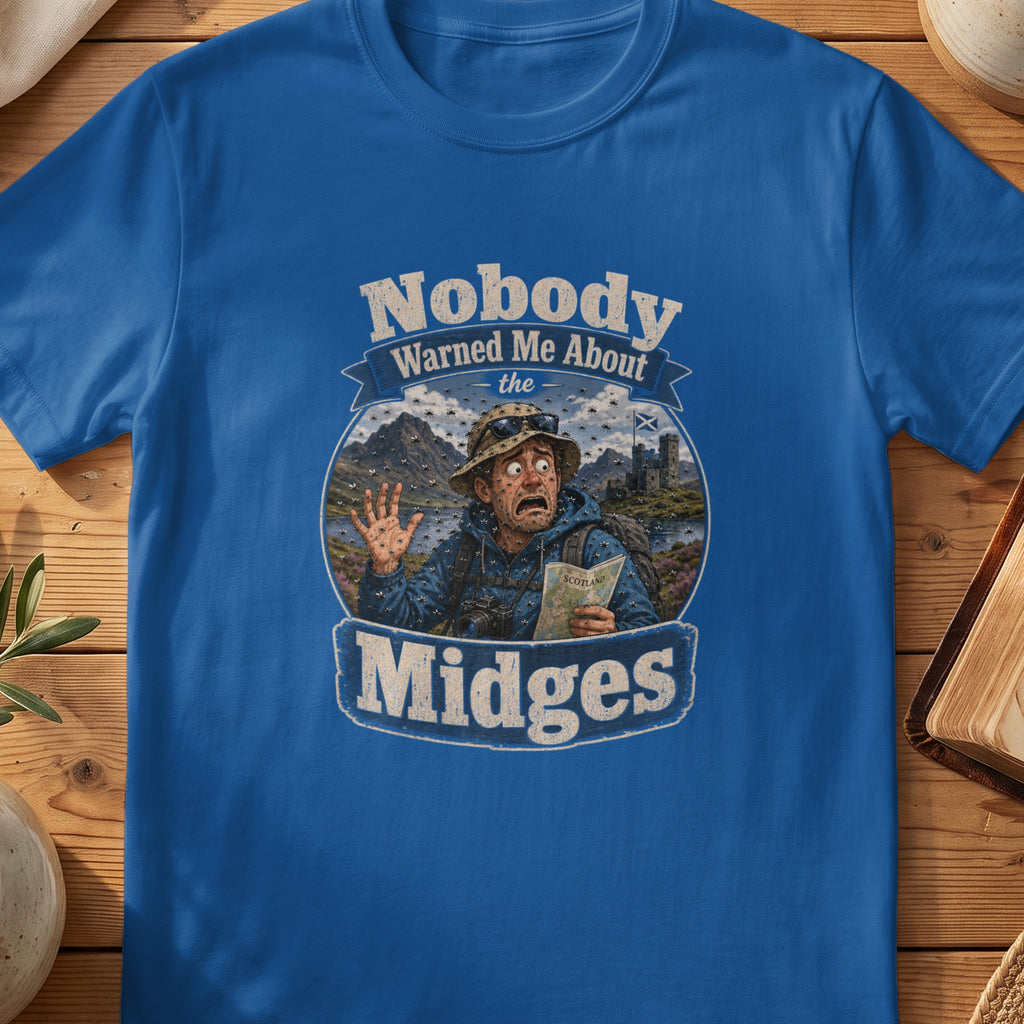 Blue t-shirt graphic of a man covered in midges, holding a Scotland map.