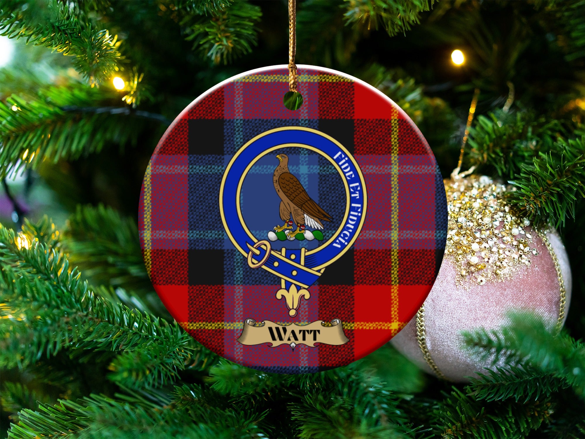 Watt clan crest tartan ceramic ornament hanging on a Christmas tree