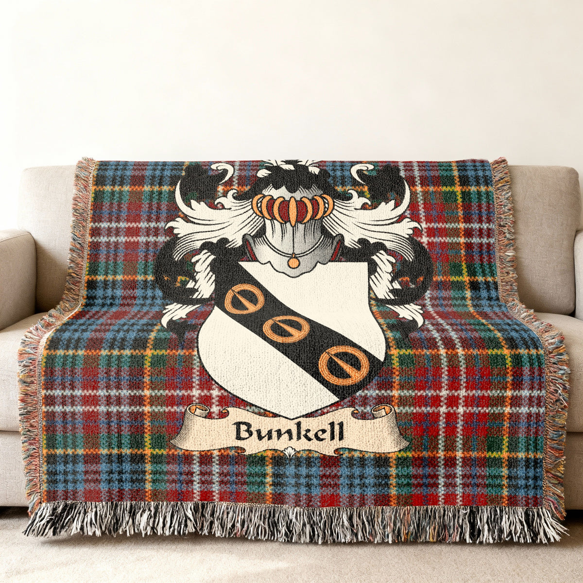 Bunkell Scottish family shield woven blanket on a Caledonia tartan background