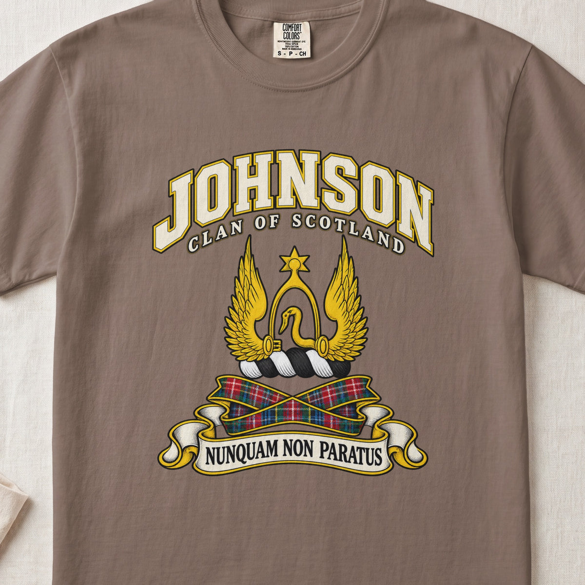 Johnson Scottish clan T-shirt in Espresso, front view with a golden winged emblem beneath a star and motto banner.