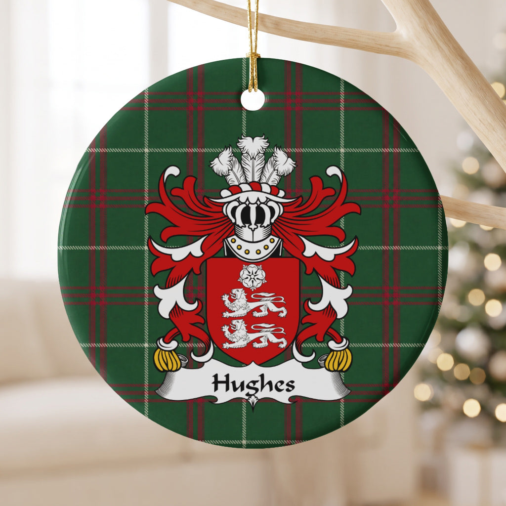 Hughes Style 3 ornament hanging from a pale wooden branch; two white lions beneath a white rose on a red shield on Welsh national tartan.