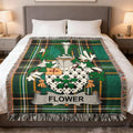 Green plaid blanket with Flower family crest and surname displayed.