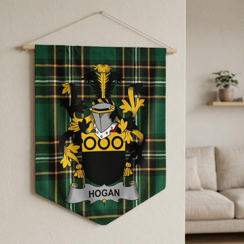Hogan family crest on green tartan banner hanging on wall.