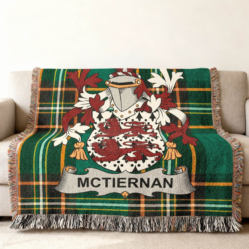 McTiernan family crest on a green plaid woven throw blanket.